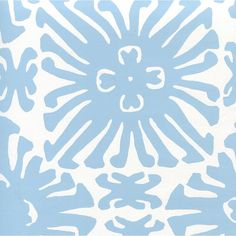 a blue and white wallpaper with an intricate design