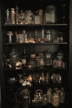 black and white photograph of shelves full of glassware