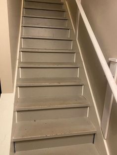 the stairs are painted white and have no railings