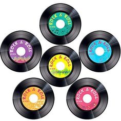 six different colored records with the words rock and roll on them