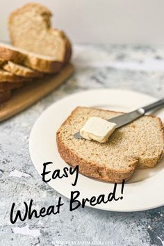 a piece of bread with butter on it and the words easy wheat bread written in black