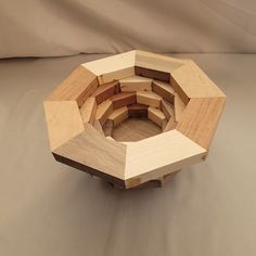 a circular wooden object sitting on top of a table