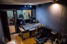 a recording studio with lots of equipment in it