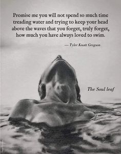 a black and white photo with a quote on the back of a person swimming in water