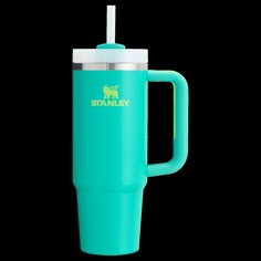 a blue travel mug with a straw sticking out of the lid and handle, on a white background