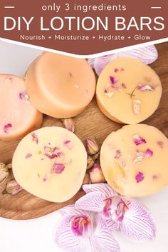 soap bars with flowers and orchid petals on a wooden plate next to the words diy lotion bars