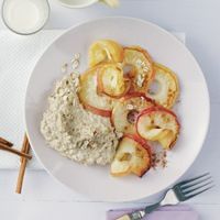 a white plate topped with food next to silverware