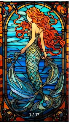 a stained glass window with a mermaid on it