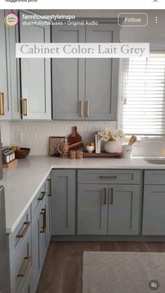 a kitchen with gray cabinets and white counter tops