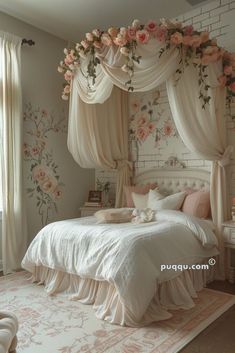 a white bed with pink flowers on the headboard and canopy over it in a bedroom