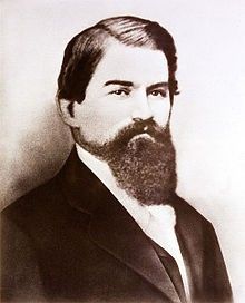 an old black and white photo of a man with a beard