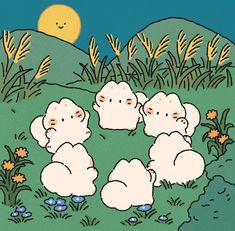 four sheep are sitting in the grass near some flowers