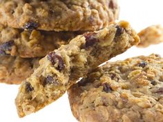 three oatmeal cookies stacked on top of each other with raisins