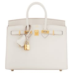 Hermes Birkin 25cm Sellier Craie Off White Cream Epsom Gold Do not miss this perfect little jewel - the only Birkin you need day and night, all four seasons! Brand New in Box. Store Fresh. Pristine Condition (with plastic on hardware) Perfect gift! Comes in full set with clochette, lock, keys, raincoat, dust bag, and Hermes box. Craie is the most coveted and incredibly gorgeous off white or cream color that is uber chic and goes with every color. Ideal with all manners of beige, brown, black, wh Hermes Birkin Bag 25, Birkin Purse, Birken Bag, Hermes Store, Hermes Kelly 25, Hermes Kelly Bag, Pop Color, Cream Bags, Hot Bags