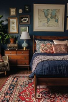 a bed room with a neatly made bed and lots of pictures on the wall above it