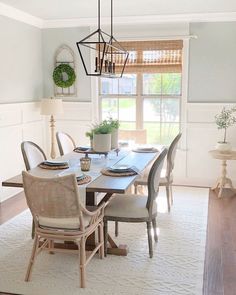 the dining room table is set with place settings