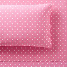 pink and white bedding with polka dots on the pillowcase, made from 100 % cotton