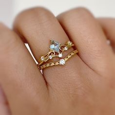 Our Avalon Stacking Ring is exquisitely designed to glam up your look. This nature-inspired stacking band features a dashing round gem at the center of a slightly curved leafy pattern band. Beauty at its peak. A dainty piece to sweep you off your feet. ✦ Available in both 14K yellow gold vermeil (14K yellow gold plated over a sterling silver base) and 10K solid yellow gold. Stackable Yellow Gold Crystal Ring, Yellow Gold Gemstone Filigree Ring, Yellow Gold Cubic Zirconia Stackable Rings, Fine Jewelry Yellow Gold Stackable Crystal Ring, Elegant 14k Gold-filled Yellow Stackable Rings, Leafy Pattern, Dainty Gold Rings, Gold Vermeil Jewelry, Stacking Bands