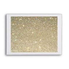 a gold glitter background with white border on the bottom, and light yellow sparkle in the middle