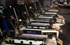 rows of electronic equipment sitting on top of wooden pallets