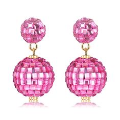 pair of pink earrings with gold accents on the end and two balls hanging from each ear