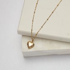 Our Small Heart Locket can be worn empty or you can add a photo of your choice to the center. Feel loved everywhere you go. Add your fur baby, your significant other, your kids, and even your favorite celebrity -- we think Dolly would be perfect! We also offer a Large Heart Locket as well! 18K Gold Plated Stainless Steel 13mm Heart Pendant Dotted 16.25" Chain with 2.5" Extender Jewelry Care: It is important to gently clean your jewelry with a soft cloth after each use. We recommend removing your Large Heart, Feel Loved, Heart Locket, Small Heart, Feeling Loved, Significant Other, Jewelry Party, Wholesale Jewelry, Earring Necklace