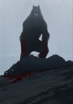 a big furry animal sitting on top of a hill with blood all over its body