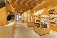 the inside of a store with wooden shelves