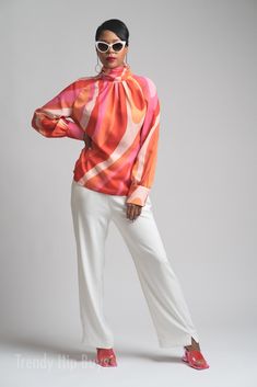 Dance the night away in our Disco Top, a fabulous tribute to 70s fashion designed for the modern woman who loves the iconic style of the era. This 70s Blouse Women is a Chiffon Blouse that captures the essence of the Turtle Neck Top trend with a touch of Groovy charm. Immerse yourself in the 70s Style Top Women, carefully crafted to showcase the free-spirited and expressive fashion that defined the disco era. The thicker chiffon material adds a luxurious feel while ensuring comfort and durabilit Elegant Multicolor Blouse With Blouson Sleeves, 70s Inspired Multicolor Tops For Spring, Elegant Multicolor Evening Blouse, Retro Long Sleeve Blouse For Evening, Retro Long Sleeve Evening Blouse, Retro Tops For Spring Night Out, Retro Tops For Night Out In Spring, Retro Multicolor Silk Tops, Party Pink Top With Blouson Sleeves