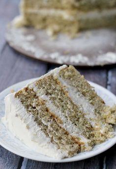 a slice of cake sitting on top of a white plate next to another piece of cake