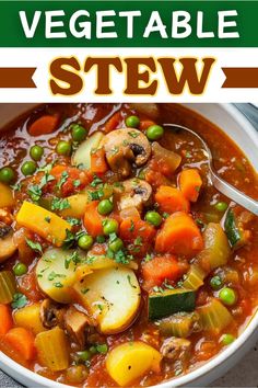 a bowl of vegetable stew with peas and carrots in it, on top of a table