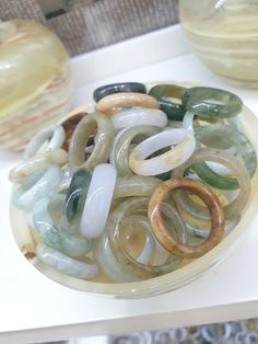 A 50 piece assortment of solid Jade bands / rings in random sizes, colors, patterns, width, thickness and translucency. Ring sizes ranging from Size 48 (US 4.75) to Size 63 (US 10.5). All Fei Cui, Type A natural Jadeite (non-bleached, non-dyed, non-treated materials). Listed price is for 50 pieces of assorted Jade rings. Icy Jade Ring, Spiritual Green Jade Rings, Gold Jade Ring With Polished Finish, Classic Jade Rings With Polished Finish, Carved Green Jade Rings, Jade Rings, Bands Rings, Jade Ring, Ring Sizes