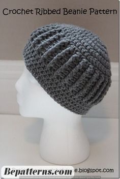 a crocheted beanie hat is shown on a mannequin head