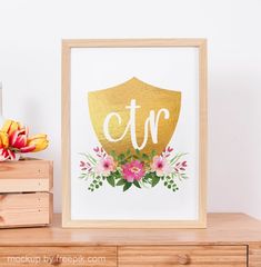 a wooden table with a vase and flowers on it next to a sign that says ctr