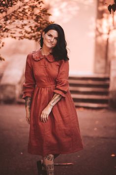 "DESCRIPTION This beautiful and feminine linen dress, with button up bodice and a ruffle collar is great for your fall wardrobe! The midi length dress with long sleeves is easy to wear and accessorize. 𝗔𝗯𝗼𝘂𝘁 𝘁𝗵𝗲 𝗱𝗿𝗲𝘀𝘀: * Dress length: 110 cm * Model is wearing size M * Relaxed fit * Fitted bodice with buttons * Gathered skirt dress * Long sleeves with ruffles * With detachable waist belt * Mid Calf length * Button down top with natural coconut buttons * Stonewashed softened linen fa Romantic Cottagecore, Pan Collar Dress, Peter Pan Collar Dress, Dress With Ruffles, Cottagecore Dress, Prairie Dress, Ruffle Collar, Gathered Skirt, Midi Length Dress