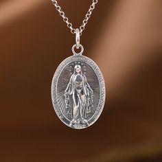 Sterling Silver Virgin Mary Pendant, Silver Oval Pendant, Religious Jewelry, Miraculous Medal, Virgin Mary Jewelry, Virgin Mary Medal (Not Including Chain) Material: 925 sterling silver Weight: 8.5g * We guarantee 100% genuine 925 Sterling Silver, If not we will refund your money. Care Instruction : 1. Avoid contact with all liquids and chemicals, such as perfume, sea water, mayonnaise, ammonia, chlorinated pool water, hair spray and sweat. Contact with these substances will increase the rate at Mary Jewelry, Water Hair, Virgin Mary Pendant, Silver Owl, Miraculous Medal, Sea Water, Hair Spray, Pool Water, Oval Pendant