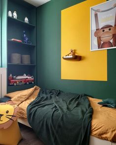 a child's bedroom with green and yellow walls