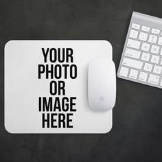 a computer mouse and keyboard on a black surface with the words your photo or image here