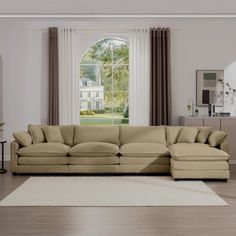 a living room with a large sectional couch and white rug in front of the window