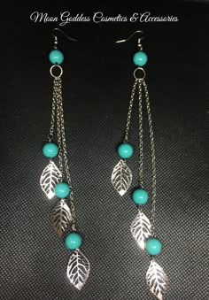 These earrings are silver toned and consists of 3 leaf charms accented with turquoise beads which dangle from 3 different size chain links with hook closure. Length: 7 inches long (Photos are taken as accurately as possible. Colors may vary depending on screen resolution/brightness) Diy Earrings Dangle, Wire Earrings Handmade, Diy Earrings Easy, Diy Jewelry Unique, Abstract Earrings, Jewelry Making Earrings, Wire Jewelry Designs, Handmade Wire Jewelry, Skull Earrings