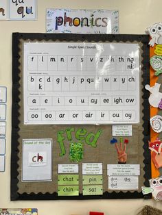 a bulletin board with words and pictures on it, along with magnets to help students learn the word phonics