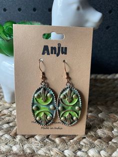 the earrings are green and brown