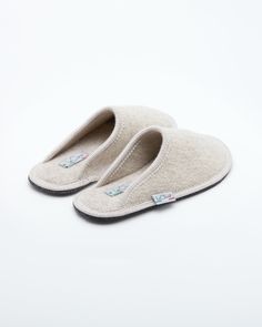 Description: The Le Clare women's Stella in beige is the classic "hotel slipper" reimagined in luxurious boiled wool. This quintessential slipper provides delicate comfort and has been handcrafted, only for the most discerning, the Stella will not disappoint. Featuring our premium Italian boiled wool fiber, the slipper gently conforms to your foot for cozy comfort. The natural elasticity of our wool bounces back to its original shape, giving the slipper lasting appeal with a customized fit. This Hotel Slippers Luxury, Cozy Beige Slip-on Slippers, Classic Closed Toe Winter Slippers, Classic Slip-on Indoor Slippers, Classic Indoor Slippers With Cushioned Footbed, Classic Beige Slippers With Round Toe, Beige Closed Toe Cushioned Slippers, Classic Beige Round Toe Slippers, Wool Slip-on Indoor Slippers