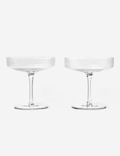 Ripple brings a fresh touch to classic glassware. Each piece is mouth-blown and molded for the vertical grooves that give this collection its signature name and charm. From water to wine to a seltzer on ice, there's a cup for every occasion. Ridged Glassware, Ripple Glassware, Coup Glasses, Tableware Inspiration, Apartment 2023, Champagne Saucers, Champagne Coupe Glasses, Wine Bucket, Rough Draft