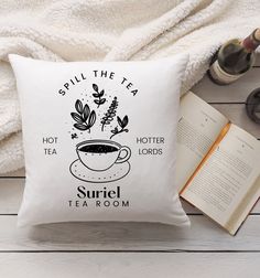 a pillow that says spill the tea, hot tea, and other items