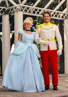 a man and woman dressed as disney characters