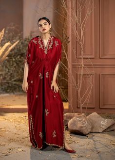 Wrap yourself in style with our Red Rawsilk Kaftan. It's a perfect blend of classic and modern, making you look effortlessly elegant. Elevate your fashion game with ease. Elegant V-neck Kurta For Festive Occasions, Silk V-neck Party Sets, Festive Floor-length Silk Kaftan, Designer Red Dabka Kaftan, Red Dabka Designer Kaftan, Festive Silk Kurta With Kimono Sleeves, Elegant V-neck Sets For Festive Occasion, Elegant V-neck Party Kimono, Bollywood Style Silk Kaftan For Evening