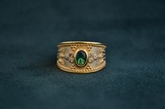 A mid-century inspired ring (Byzantine/Etruscan), that is made with solid Sterling Silver (925 silver). The outer layer is 22K Gold-plated, and in the middle there is an oval cz Emerald. Around it, there are 6 small white CZs. Byzantine Ring, Byzantine Gold, Byzantine Rings, Byzantine Jewelry, Medieval Rings, Gold Amethyst Ring, Multi Gemstone Ring, Handmade Sterling Silver Rings, Greek Jewelry