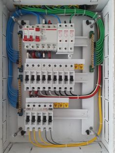 an electrical panel with multiple wires and other equipment in the box, all connected to each other