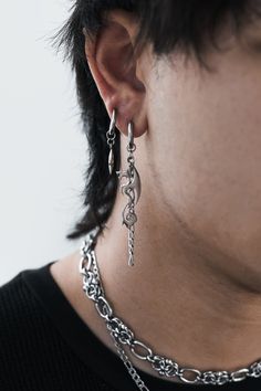 Dragons, chains and spikes - simply badass.    ★ Hand-crafted to order. ★ Available in silver stainless steel only. ★ Available as a singular earring or pair. ★ Full Stainless Steel. High quality long-lasting jewelry.. ★ 2 earring types available:  10mm Hoops, and 10mm Clip On Hoops. Fully Stainless Steel.